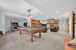 This stunning property boasts a spacious game room, perfect for entertaining and relaxation.