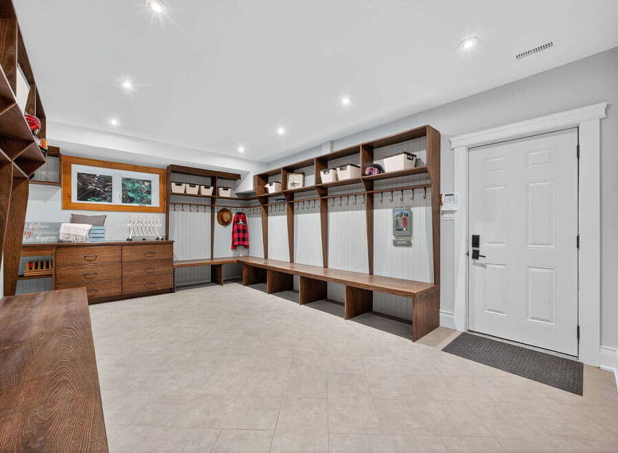 This stunning entryway boasts custom built-ins, perfect for organizing and storing belongings.