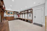 This stunning entryway boasts custom built-ins, perfect for organizing and storing belongings.