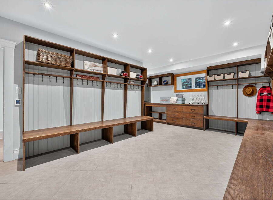 This stunning mudroom offers a blend of functionality and style, perfect for organizing your belongings.
