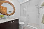Step into a beautifully designed bathroom featuring a unique wooden-framed mirror, adding a touch of natural elegance.