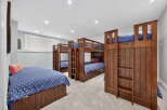 This stunning bedroom boasts multiple bunk beds, perfect for accommodating a large family or hosting guests.