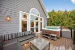 Enjoy luxurious outdoor living with this stunning property! Featuring a spacious deck, a relaxing hot tub, and a comfortable outdoor seating area, this home is perfect for entertaining or unwinding.