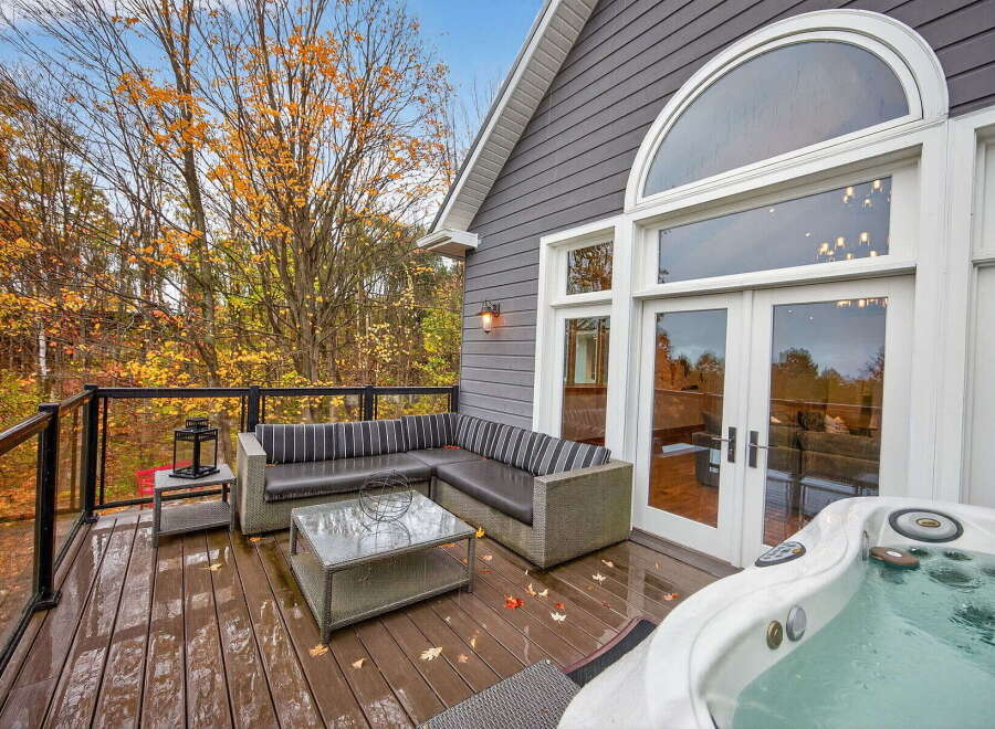 Enjoy the ultimate relaxation in this stunning outdoor oasis! This property features a luxurious hot tub, perfect for unwinding after a long day.