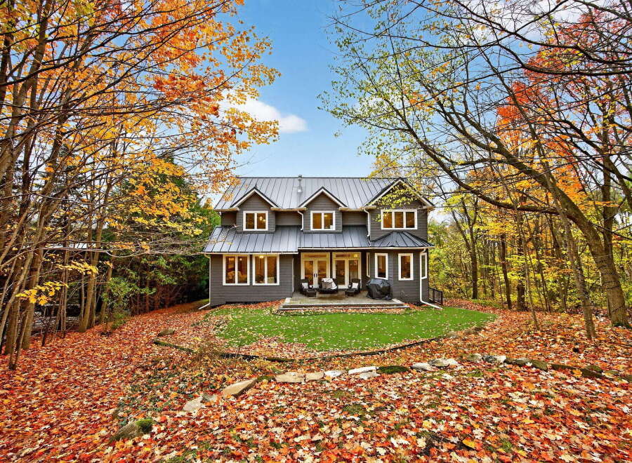Nestled amidst the vibrant hues of autumn, this stunning property offers a serene escape.