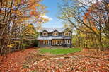 Nestled amidst the vibrant hues of autumn, this stunning property offers a serene escape.