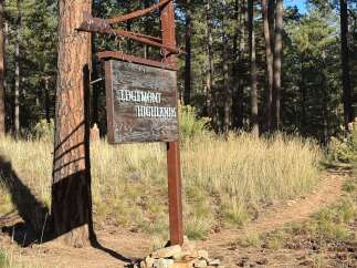 Discover the charm of Edgemont Highlands! This picturesque sign welcomes you to a community surrounded by lush forests and scenic trails.