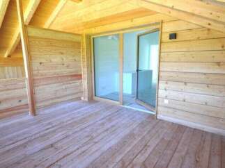 Discover the charm of this stunning wooden interior, perfect for a cozy retreat.