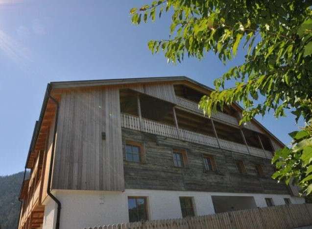 Discover a charming wooden house nestled in a serene environment.