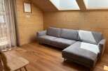 Discover the charm of this cozy living space, featuring a stylish gray sectional sofa perfect for relaxation.