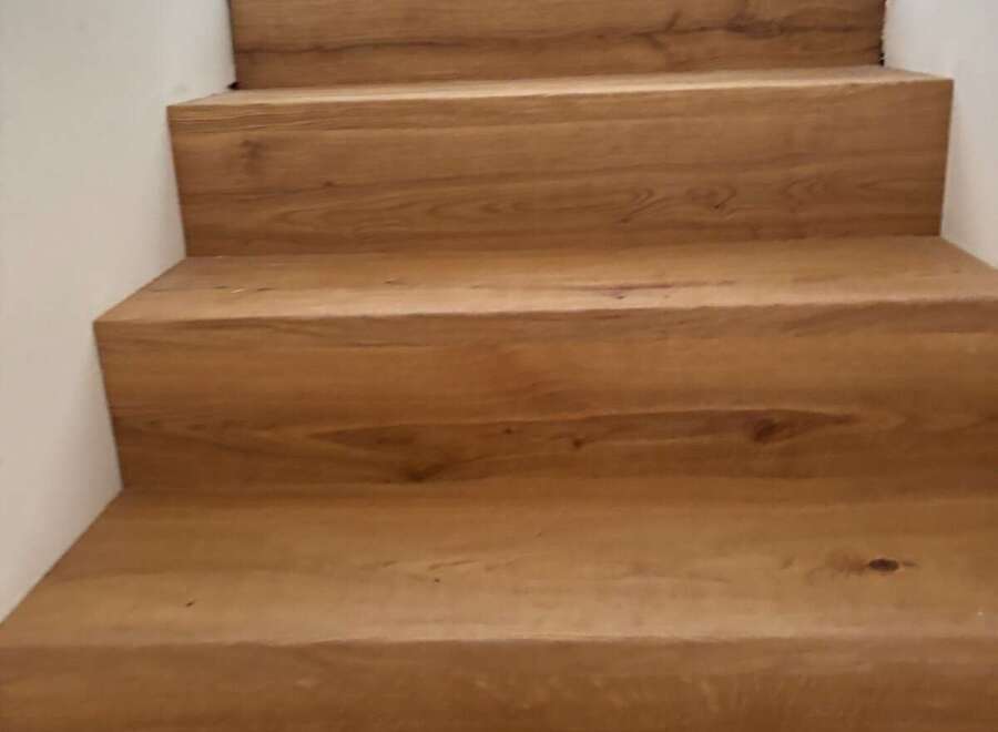 Stunning wooden staircase showcasing exquisite craftsmanship and timeless elegance.
