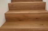 Stunning wooden staircase showcasing exquisite craftsmanship and timeless elegance.