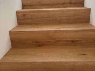 Stunning wooden staircase showcasing exquisite craftsmanship and timeless elegance.