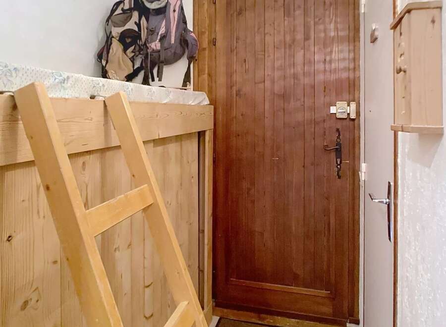 Discover this charming property featuring a cozy wooden interior and a functional layout.