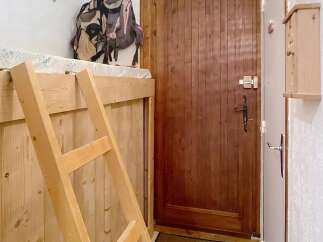 Discover this charming property featuring a cozy wooden interior and a functional layout.