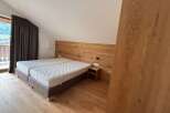 This cozy bedroom features a comfortable double bed with a wooden headboard, perfect for a relaxing stay.