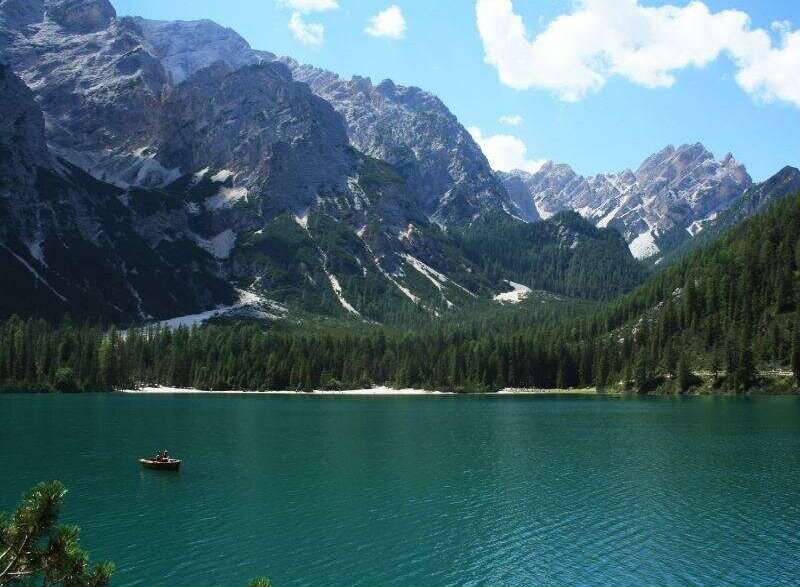 Experience the tranquility of this stunning lakeside property, nestled amidst majestic mountains.