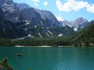 Experience the tranquility of this stunning lakeside property, nestled amidst majestic mountains.