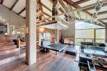 Experience luxury living in this stunning property, featuring a unique architectural design with exposed wooden beams and high ceilings.