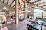 Experience the epitome of luxury living in this stunning property, boasting a unique architectural design with exposed wooden beams and expansive windows.