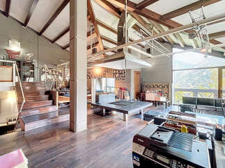 Experience the epitome of luxury living in this stunning property, boasting a unique architectural design with exposed wooden beams and expansive windows.