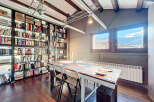 This stunning property boasts a unique library with floor-to-ceiling bookshelves, perfect for book lovers.
