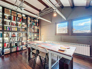 This stunning property boasts a unique library with floor-to-ceiling bookshelves, perfect for book lovers.