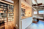 Discover a unique property featuring a stunning kitchen seamlessly integrated with a library.
