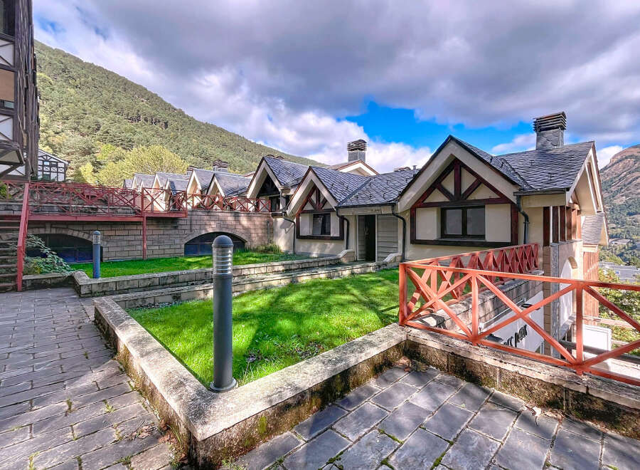 Discover the charm of this stunning property, featuring a unique architectural design with a slate roof and timber accents.