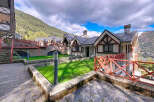 Discover the charm of this stunning property, featuring a unique architectural design with a slate roof and timber accents.