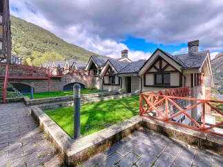 Discover the charm of this stunning property, featuring a unique architectural design with a slate roof and timber accents.