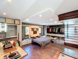 Step into luxury with this stunning bedroom featuring a spacious layout and modern design.