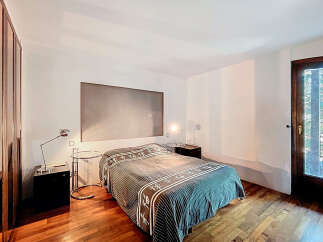 Discover the elegance of this bedroom, featuring a sleek design and modern aesthetic.