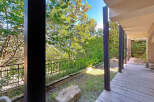 Enjoy the tranquility of this stunning property with a covered patio, perfect for relaxing and entertaining.