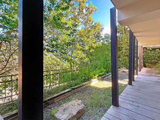 Enjoy the tranquility of this stunning property with a covered patio, perfect for relaxing and entertaining.