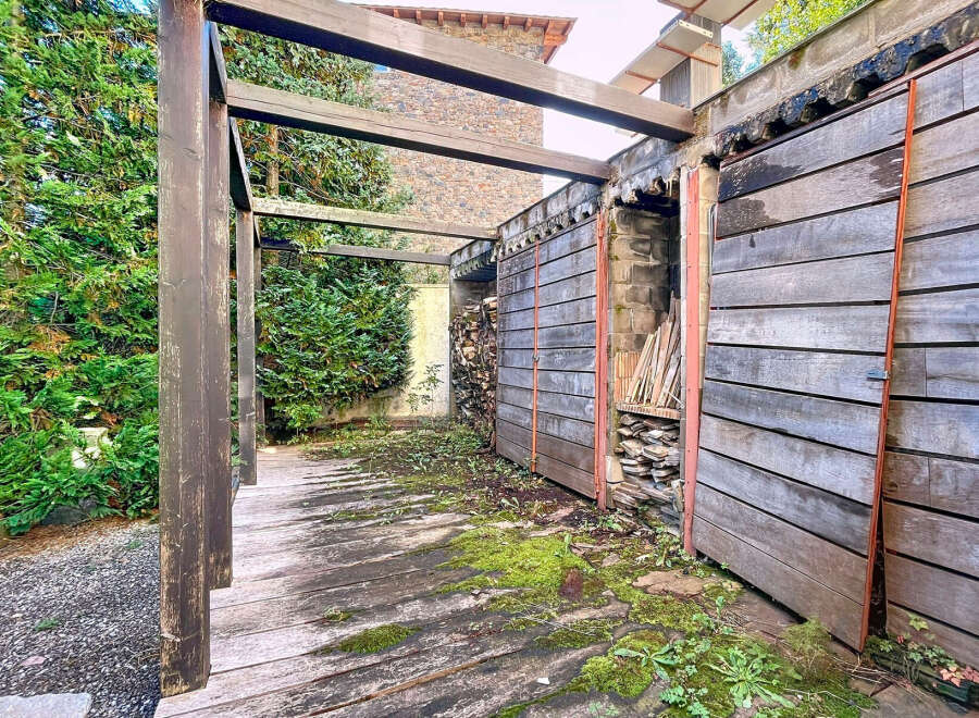 Discover the charm of this unique property, featuring a rustic wooden structure and a serene outdoor space.