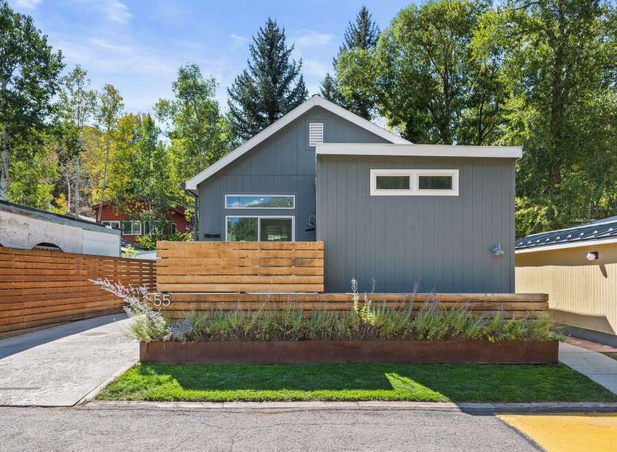 This stunning modern home at 55 offers a perfect blend of style and functionality.