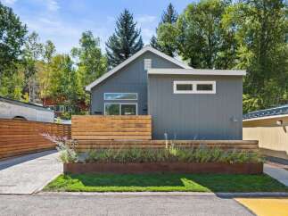 This stunning modern home at 55 offers a perfect blend of style and functionality.
