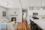 This stunning property boasts a cozy living room with a fireplace, perfect for relaxing evenings.