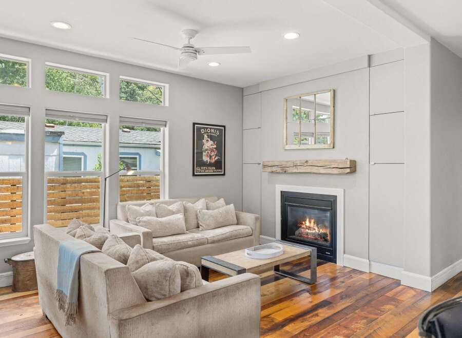 Step into luxury with this stunning living room, boasting a cozy fireplace and elegant design.
