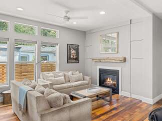 Step into luxury with this stunning living room, boasting a cozy fireplace and elegant design.