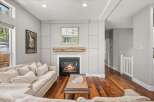 This stunning living room boasts a cozy fireplace, perfect for chilly evenings.