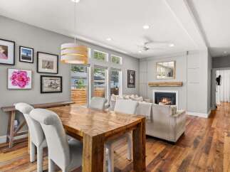 Step into this stunning home featuring a cozy fireplace, perfect for those chilly evenings.