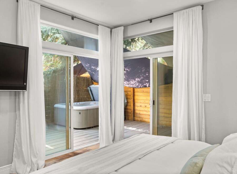 Enjoy luxury living with this stunning property featuring a private hot tub and a serene outdoor space.