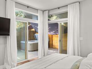 Enjoy luxury living with this stunning property featuring a private hot tub and a serene outdoor space.