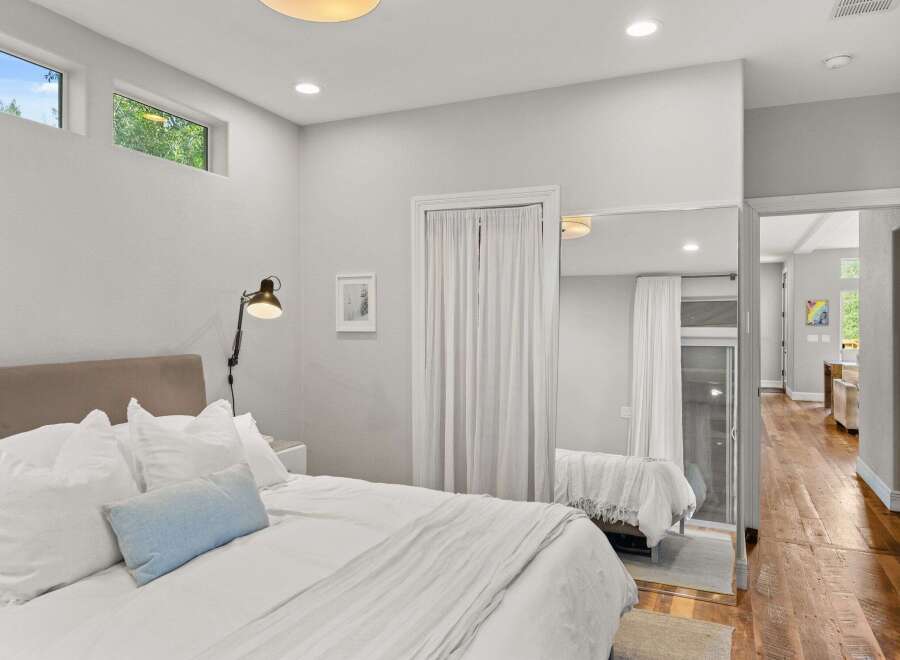 This stunning bedroom boasts a modern design with clean lines and ample natural light.