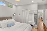 This stunning bedroom boasts a modern design with clean lines and ample natural light.