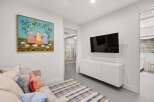 This stunning property boasts a modern living space, perfect for relaxation and entertainment.