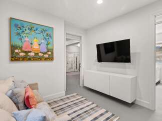 This stunning property boasts a modern living space, perfect for relaxation and entertainment.