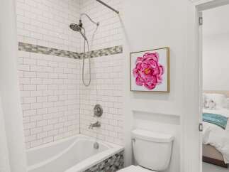 This stunning bathroom features a modern design with a beautiful shower and a stylish toilet.